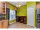 Dining room with tile floors, modern lighting and a large window at 303 White Water Bay Dr, Groveland, FL 34736