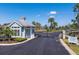 Elegant gated community entrance with lush landscaping, providing security and a welcoming neighborhood ambiance at 303 White Water Bay Dr, Groveland, FL 34736
