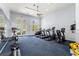 Gym featuring cardio machines, free weights, and ample natural light streaming in from outside at 303 White Water Bay Dr, Groveland, FL 34736