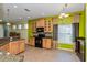 Kitchen with tile floors, stainless steel appliances, and wooden cabinets at 303 White Water Bay Dr, Groveland, FL 34736