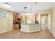 Spacious kitchen with tiled floors, wood cabinets, a breakfast bar, and stainless steel appliances at 303 White Water Bay Dr, Groveland, FL 34736