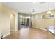 Bright, open living room features tile floors, an arched doorway, and large sliding doors at 303 White Water Bay Dr, Groveland, FL 34736