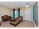 Cozy living room featuring neutral walls, tile flooring, and elegant seating at 303 White Water Bay Dr, Groveland, FL 34736