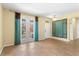 Bright living room featuring tile floors, double doors, and modern decor accents at 303 White Water Bay Dr, Groveland, FL 34736