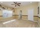 Spacious main bedroom with ample natural light, fan, and ensuite bathroom access at 303 White Water Bay Dr, Groveland, FL 34736