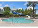 Community pool with a water slide and sun loungers perfect for relaxation and recreation at 303 White Water Bay Dr, Groveland, FL 34736