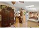 An open kitchen seamlessly flows into the dining area, enhancing the home's social atmosphere at 313 Westwood Dr, Leesburg, FL 34748