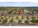 Aerial view of a residential area featuring well-maintained lawns and mature trees at 3206 Sonesta Ct # A, Clermont, FL 34711