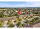 Wide aerial shot of a townhome community, showcasing the neighborhood's layout and landscaping at 3206 Sonesta Ct # A, Clermont, FL 34711