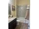 Cozy bathroom featuring granite counters, tiled shower, and neutral color palette at 3206 Sonesta Ct # A, Clermont, FL 34711