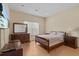 Bright bedroom with wood floors, neutral walls, and a comfortable bed at 3206 Sonesta Ct # A, Clermont, FL 34711