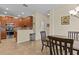 Kitchen area with stainless steel appliances and an adjacent dining area with wooden table and chairs at 3206 Sonesta Ct # A, Clermont, FL 34711