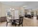 The dining area has a round wood table and provides access to the living area at 3206 Sonesta Ct # A, Clermont, FL 34711