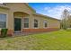 The front entrance features a dark green door, brick walkway, and manicured lawn at 3206 Sonesta Ct # A, Clermont, FL 34711