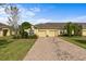 Charming townhome with a brick driveway, attached garage, and well-maintained landscaping at 3206 Sonesta Ct # A, Clermont, FL 34711