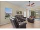 Inviting living room with tile floors, ceiling fan, and comfortable seating at 3206 Sonesta Ct # A, Clermont, FL 34711