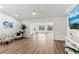 Open living room featuring wood floors, open floorplan, and lots of natural light at 32222 Summertree Circle, Leesburg, FL 34748