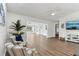 Spacious living room with luxury vinyl plank flooring and an open concept view of Florida Room at 32222 Summertree Circle, Leesburg, FL 34748