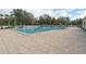 Spacious community pool featuring a large sun deck with plentiful seating at 32222 Summertree Circle, Leesburg, FL 34748