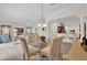 Open-concept dining area connecting to the kitchen and living space, filled with natural light at 3262 Dalkeith Ter, The Villages, FL 32163