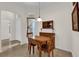 Cozy dining area with window, table with two chairs, and tile flooring at 3262 Dalkeith Ter, The Villages, FL 32163