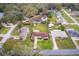 Expansive aerial view of a single-Gathering home featuring a large backyard and mature trees in a quiet neighborhood at 330 N Sunset Dr, Mount Dora, FL 32757