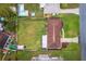 Aerial view showcasing the property's large backyard and surrounding neighborhood at 330 N Sunset Dr, Mount Dora, FL 32757