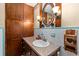 Classic bathroom featuring wooden cabinets and traditional fixtures at 330 N Sunset Dr, Mount Dora, FL 32757