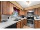 Spacious kitchen featuring stainless steel appliances, and wood cabinets at 330 N Sunset Dr, Mount Dora, FL 32757