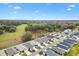 A scenic aerial view of the neighborhood, showing the community layout and surrounding green spaces at 3320 Davis Ter, The Villages, FL 32163