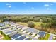 Neighborhood aerial view with beautiful landscaping and natural surroundings at 3320 Davis Ter, The Villages, FL 32163