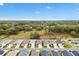 An aerial view of the neighborhood, showcasing its layout, green spaces, and surrounding natural beauty at 3320 Davis Ter, The Villages, FL 32163