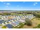 Aerial view of the neighborhood with lush greenery and scenic views at 3320 Davis Ter, The Villages, FL 32163