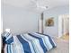 Bedroom featuring blue and white bedding, carpeted floors, and white walls at 3320 Davis Ter, The Villages, FL 32163