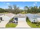 Charming single-story home with well-maintained landscaping and a two-car garage at 3320 Davis Ter, The Villages, FL 32163