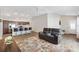 Inviting living area showcasing an open layout with a kitchen island and lots of natural light at 3320 Davis Ter, The Villages, FL 32163