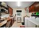 Functional laundry room with counter space, cabinetry, and modern appliances at 3426 Boardroom Trl, The Villages, FL 32163