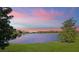 A stunning view of the pond at sunset at 3426 Boardroom Trl, The Villages, FL 32163