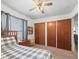 Cozy bedroom featuring a ceiling fan and wood-trimmed accents for a warm, inviting feel at 422 W Hunt Ave, Bushnell, FL 33513