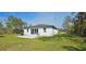 A backyard view features sliding glass doors and a patio with room to grill at 42329 Chinaberry St, Eustis, FL 32736