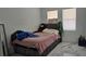 Well-lit bedroom with plush bed, decorative pillows, and large windows at 42329 Chinaberry St, Eustis, FL 32736