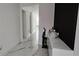 Bright hallway featuring modern marble tile flooring and minimalist decor at 42329 Chinaberry St, Eustis, FL 32736