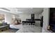 Modern kitchen with marble floors, island seating, and sleek cabinetry at 42329 Chinaberry St, Eustis, FL 32736
