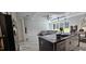 Modern kitchen area with an island, stainless steel appliances and plenty of counter space at 42329 Chinaberry St, Eustis, FL 32736