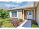 Inviting front entrance with manicured landscaping, showcasing the home's curb appeal at 4331 Arlington Ridge Blvd, Leesburg, FL 34748