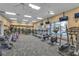 Well-equipped gym with treadmills, stationary bikes, and elliptical machines overlooking the community pool at 4331 Arlington Ridge Blvd, Leesburg, FL 34748