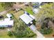 Aerial view of the home showcasing the metal roof, carport, and surrounding landscape at 4552 Cr 300, Lake Panasoffkee, FL 33538