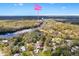 Scenic aerial view of the property surrounded by lush greenery and waterfront views at 4552 Cr 300, Lake Panasoffkee, FL 33538