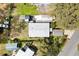 Aerial view of the home, showing the roof, yard, driveway, and proximity to surrounding neighborhood at 4552 Cr 300, Lake Panasoffkee, FL 33538