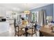 Bright dining area featuring a glass table, chairs, and ample natural light at 4552 Cr 300, Lake Panasoffkee, FL 33538